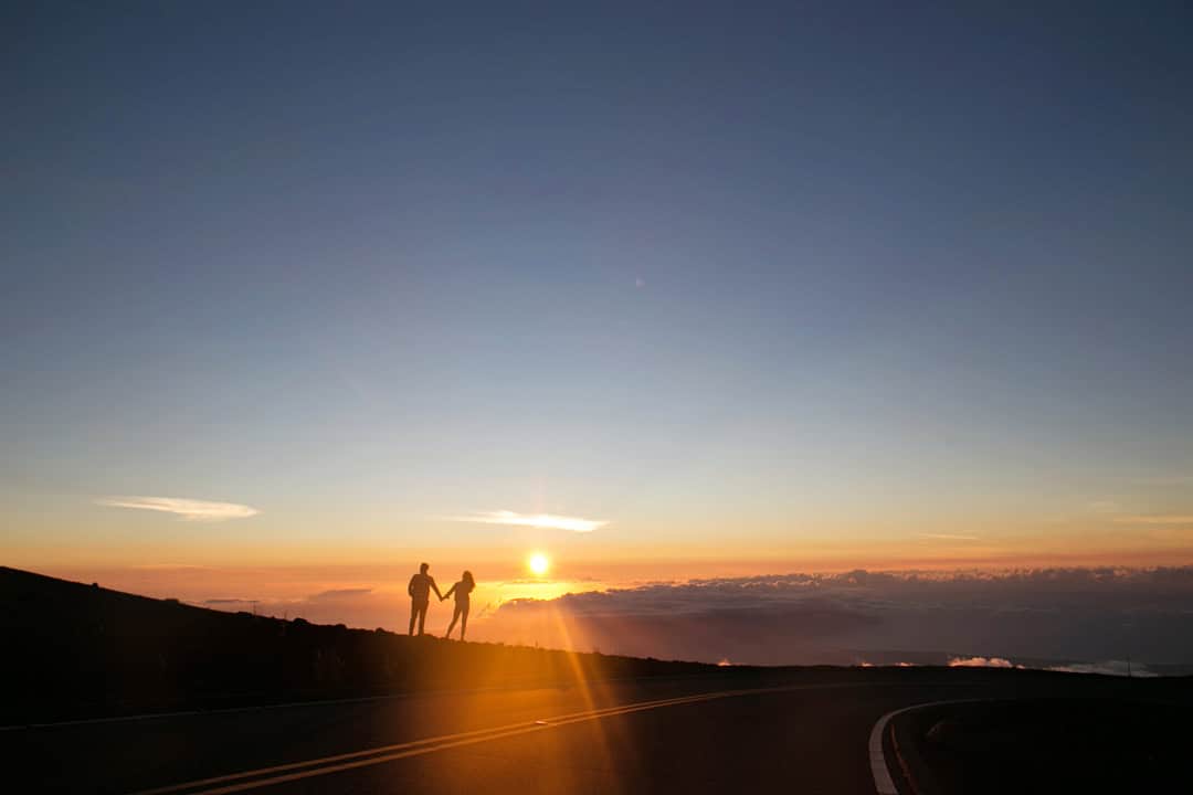 A couple at a mountain sunrise