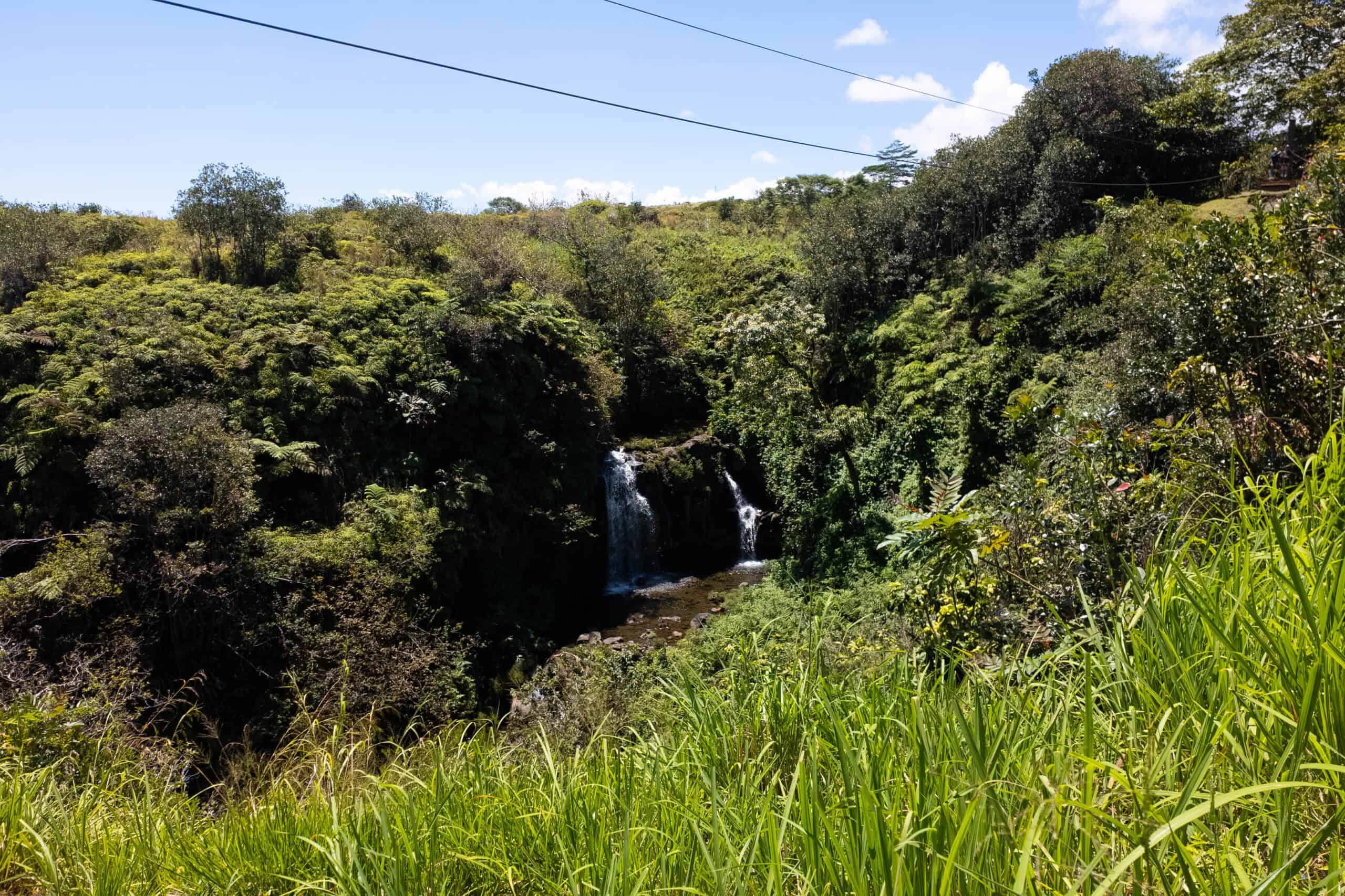 A zipline going over a double waterfall