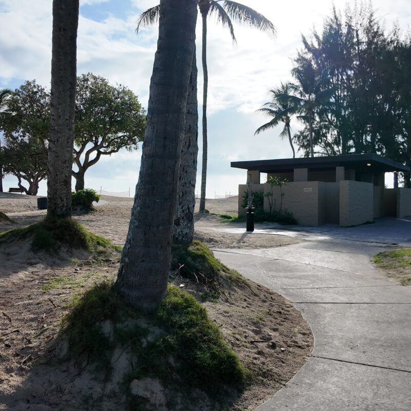 A sidewalk and restrooms at Kailua Beach Park in Oahu