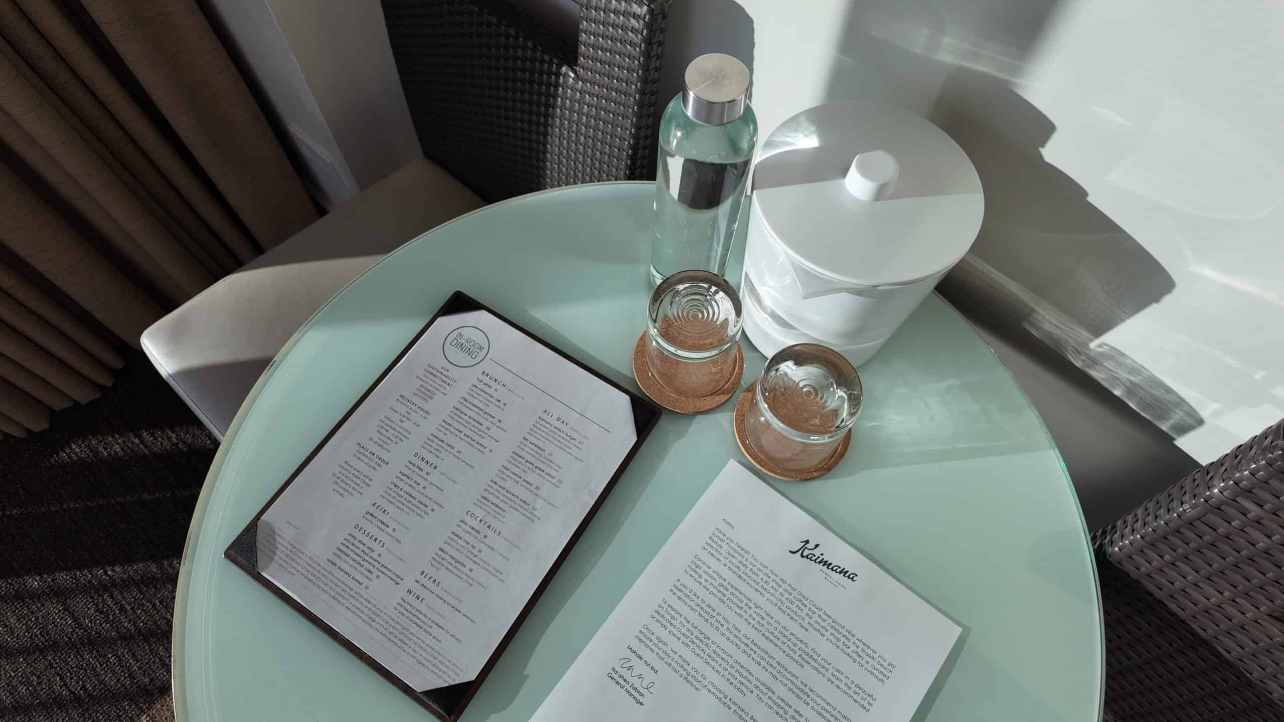 Menus, glasses and an ice bucket at Kaimana Beach Hotel