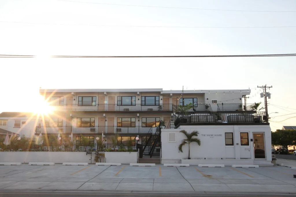 The Shore House hotel in Wildwood NJ with the sun setting behind it